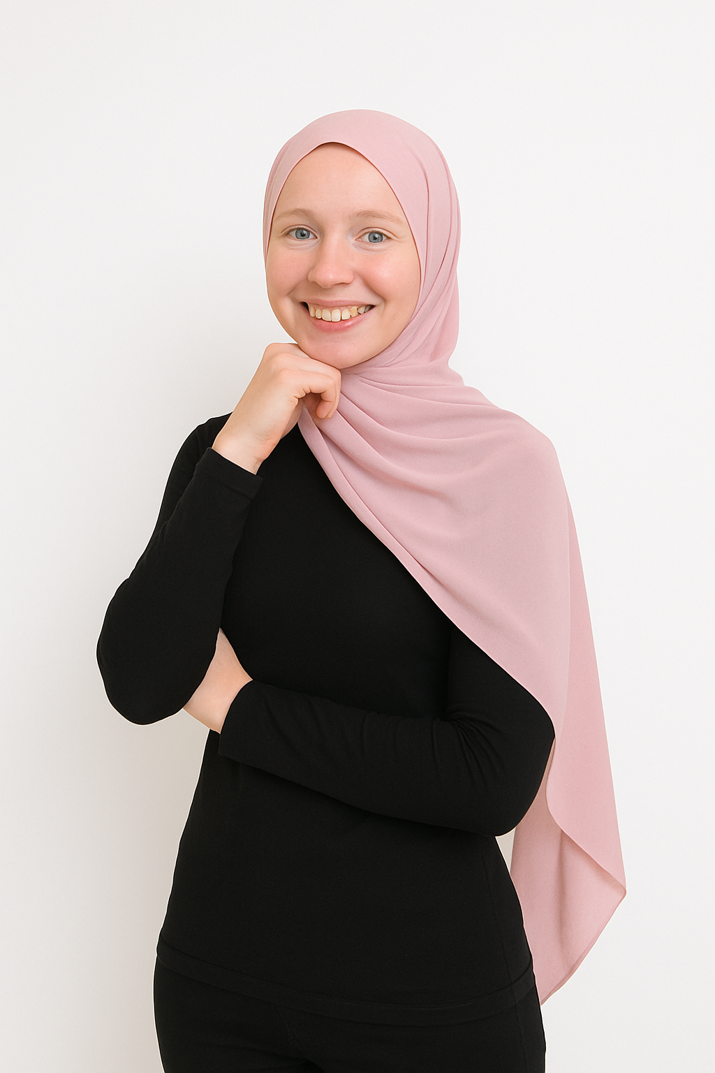 Smiling woman in light pink hijab posing confidently.